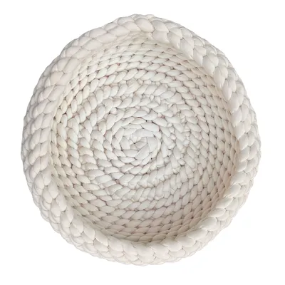Panier rond tressé en tissu blanc, vu de dessus, sans marque visible ni texte.