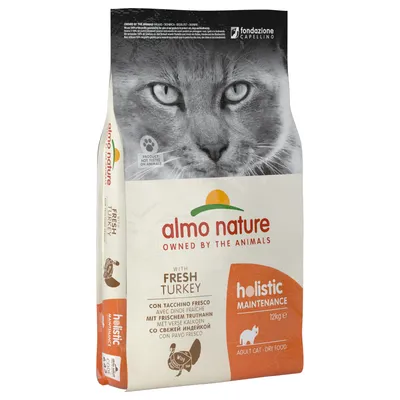 Опаковка на Almo Nature Holistic Maintenance суха храна за котки, 12 кг, със свежа пуйка. Видим текст: 'Owned by the animals', 'With fresh turkey', 'Adult cat - dry food'.