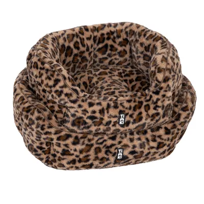 Tiaki pet bed with leopard pattern, soft material, two sizes visible.