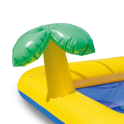 Keltainen ja sininen puhallettava lelu, jossa vihreä palmukuosi, sopii vesileikkeihin.