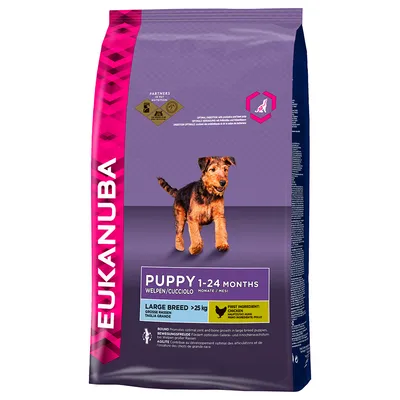 Eukanuba Puppy 1–24 Months, Large Breed >25 kg, primeiro ingrediente: frango. Saco de ração com imagem de cachorro e texto em inglês sobre crescimento articular e ósseo.