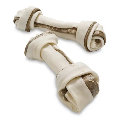 To knudeben af lyst og mørkt tørret materiale, uden synlige mærker eller tekst. Benene har en snoet form med knuder i enderne.