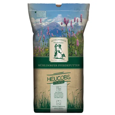 Mühldorfer Pferdefutter Heucobs, støvfri, uden melasse og tilsat sukker, optimal spytproduktion. Emballage med bjergeng og logo.