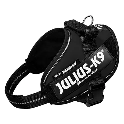 Черен Julius-K9 IDC нагръдник за кучета с отразителни ленти и надпис 'Glowing in dark'.