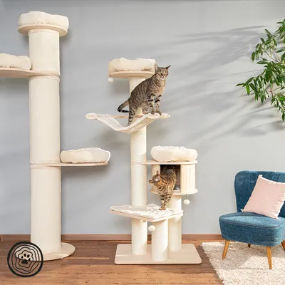 Multi-level cat tree with platforms, scratching posts, soft beds and two cats climbing and resting on it, shown in a living room setting.
