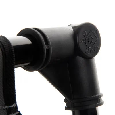 Close-up of a black plastic connector with embossed logo and symbols, suitable for accessory assembly.