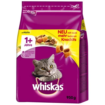 Pienso Whiskas con pollo para gatos adultos 1+ años, envase de 950 g. Texto visible: 'NEU mit noch mehr leckeren Knackits', '100% komplett & ausgewogen', 'Gesunde Zähne'. Pienso Whiskas con pollo para gatos adultos 1+ años, envase de 950 g. Texto visible: 'NEU mit noch mehr leckeren Knackits', '100% komplett & ausgewogen', 'Gesunde Zähne'.