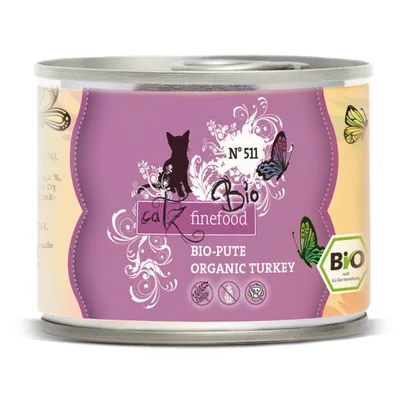 catz finefood Bio N°511, BIO-PUTE ORGANIC TURKEY, violetti etiketti, perhonen, Bio-merkintä kannessa. Kissanmärkäruokapurkki, näkyvissä myös kolme pientä symbolia.