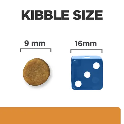 Kibble size comparison showing a 9mm round kibble next to a 16mm blue dice for scale.