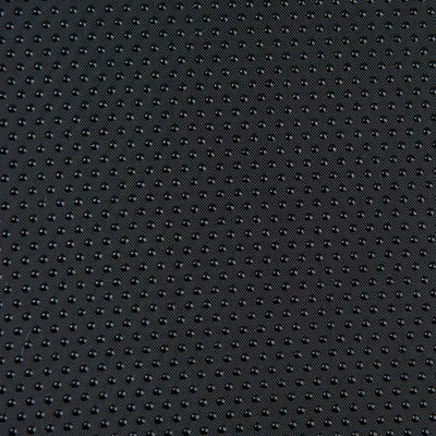 Nahaufnahme eines schwarzen, rutschfesten Materials mit kleinen Punkten für besseren Halt.