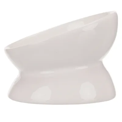 White, slanted ceramic bowl with elevated base, suitable for food or water.