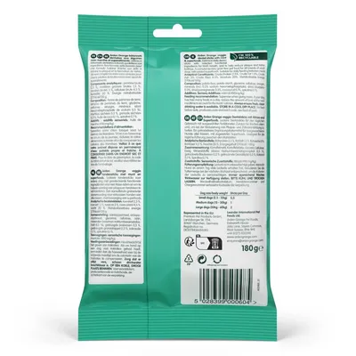 Back of product pack showing ingredients, feeding guide by dog size, storage instructions, recycling symbols and barcode. Text in multiple languages. Net weight: 180g.