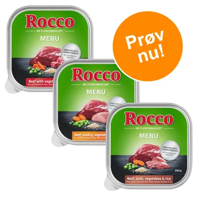 Tre bakker Rocco MENU vådfoder: Beef with vegetables, Beef, poultry, vegetables & rice, Beef, lamb, vegetables & rice. Tekst: Prøv nu! Synlige grøntsager og kød på emballagen.