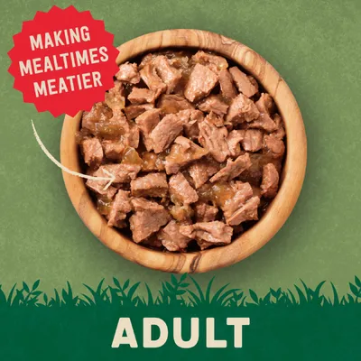 Bowl of meaty chunks with text 'Making mealtimes meatier' and 'Adult', indicating product is designed for adult pets and highlights increased meat content.