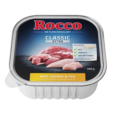 Rocco Classic Extra, 300 г. Видны куски мяса и курицы, надписи: with chicken & rice, с рисом, омега-3, пищевые волокна. Текст на английском и немецком языках.