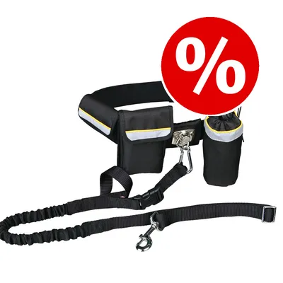 Cinturón negro con bolsillos y correa para perro, detalles reflectantes. Círculo rojo con símbolo de porcentaje blanco indica oferta o descuento visible en la imagen.