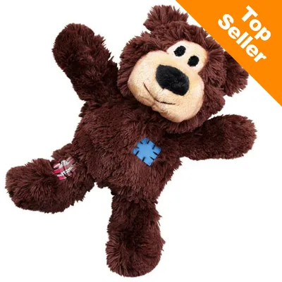 Giocattolo per cani a forma di orso marrone in peluche con toppe colorate. Angolo arancione in alto a destra con testo: Top Seller.