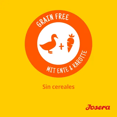 Grain Free, mit Ente & Karotte, Sin cereales, Josera. Texto en alemán e inglés sobre ausencia de cereales y presencia de pato y zanahoria. Marca Josera visible.