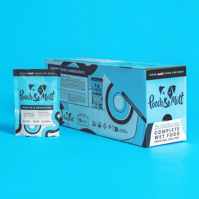 Pouch and box of Pooch & Mutt Health & Digestion complete wet food, grain free and junk-free, for sensitive dogs. Box contains 12 x 300g pouches. Feeding guide and ingredients visible.