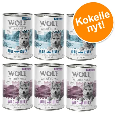 Wolf of Wilderness Junior -koiran märkäruoka, 3 x Blue River ja 3 x Wild Hills, tölkit 400 g. Oranssi merkki: Kokeile nyt!