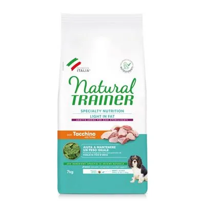 Zak Natural Trainer Specialty Nutrition Light in Fat hondenvoer, con Tacchino, 7 kg. Afbeelding van kalkoenstukjes, groene bladeren en hond op de verpakking. Tekst deels Italiaans.