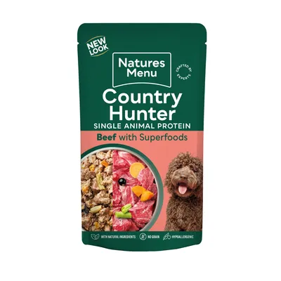 Country Hunter single animal protein beef with superfoods, with natural ingredients, no grain, hypoallergenic. Image shows food mix and a dog. New look packaging.