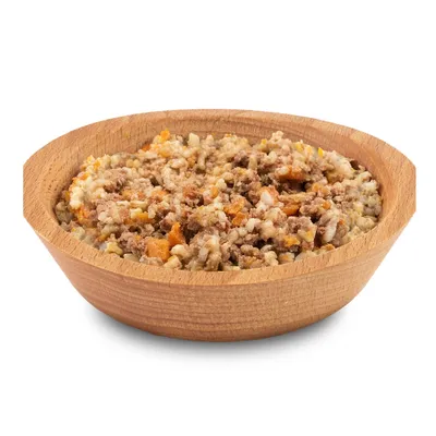 Bowl filled with mixed wet pet food containing visible chunks of meat and vegetables.
