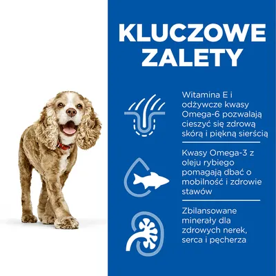 Kluczowe zalety: witamina E i kwasy Omega-6 dla zdrowej skóry i sierści, Omega-3 z oleju rybiego wspiera stawy, zbilansowane minerały dla nerek, serca i pęcherza. Obraz psa obok tekstu.