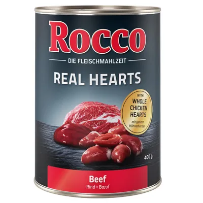 Tin labelled 'Rocco Real Hearts' with beef and whole chicken hearts, 400g. Text highlights inclusion of whole chicken hearts. Product type: Beef.
