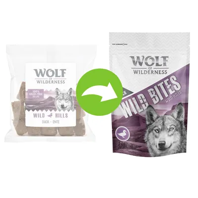 Changement d’emballage : Wolf of Wilderness Wild Hills Duck, 100 % grain-free recipe, ancien et nouveau sachet visibles avec logo tête de loup.
