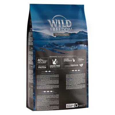 Wild Freedom Triple Taste cat food bag, visible text: 40% fresh fish & meat, high-quality protein, grain-free recipe, species-appropriate, made in Germany, recyclable material.