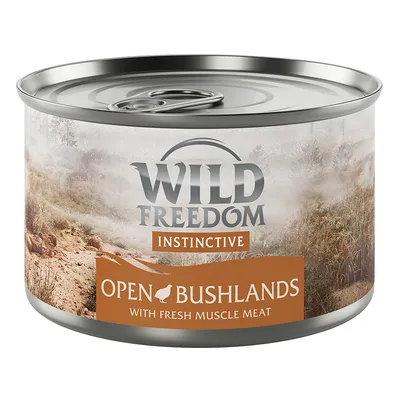 Boîte de pâtée Wild Freedom Instinctive, Open Bushlands, with fresh muscle meat. Texte en anglais sur l’étiquette.