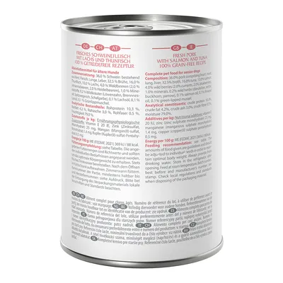 Dose mit der Aufschrift: Frisches Schweinefleisch mit Lachs und Thunfisch, 100% getreidefreie Rezeptur. Alleinfuttermittel für ältere Hunde. Zusammensetzung und Fütterungsempfehlung sichtbar.