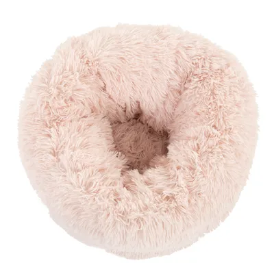 Panier rond pour animal, aspect fourrure rose clair, rebords épais et centre creux visible, matière textile pelucheuse.