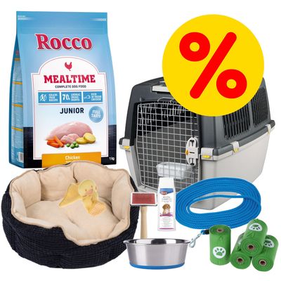 Rocco Mealtime Junior Hundefutter mit Huhn, Hundebett, Transportbox, Hundeshampoo, Bürste, Futternapf, blaue Leine und grüne Kotbeutel. Gelbes Prozentzeichen für Rabatt.