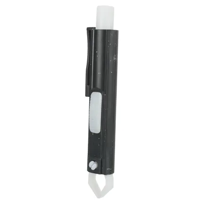 Tick remover made of black plastic with white slider and gripping mechanism for removing ticks.