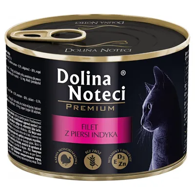 Dolina Noteci Premium tin with cat image, text: FILET Z PIERSI INDYKA. Icons: single protein, grain free, vitamins and minerals D3 E Zn. Some product info in Polish visible.