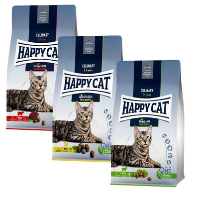Tre poser Happy Cat Culinary 1+ years kattefoder: Voralpen Rind, Land Geflügel, Weide Lamm. Synlige billeder af kat og foderpiller på hver pose samt engelske og tyske produktnavne.