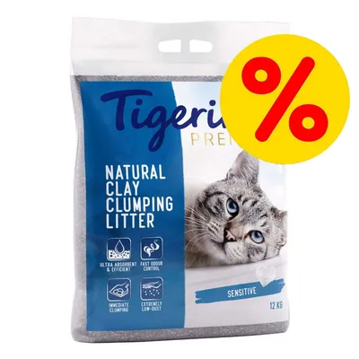 Tigerino Premium Natural Clay Clumping Litter Sensitive 12 kg. Texto visible: ultra absorbent & efficient, fast odour control, immediate clumping, extremely low-dust. Símbolo de porcentaje.