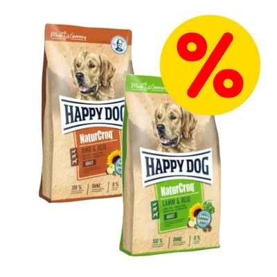 To poser Happy Dog NaturCroq hundefoder: Rind & Reis og Lamm & Reis. Stor gul procenttegn indikerer tilbud eller rabat. To poser Happy Dog NaturCroq hundefoder: Rind & Reis og Lamm & Reis. Stor gul procenttegn indikerer tilbud eller rabat.