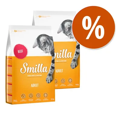 Due confezioni di Smilla Adult Beef 10 kg con immagine di gatto, scritte 'FOOD FOR A LIFETIME', simboli ingredienti e grande simbolo percentuale bianco su sfondo arancione.