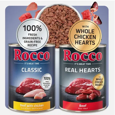 Dwie puszki Rocco: Classic Beef with chicken 400 g, Real Hearts Beef 400 g. Widoczne napisy: 100% fresh ingredients & grain-free recipe, with whole chicken hearts.