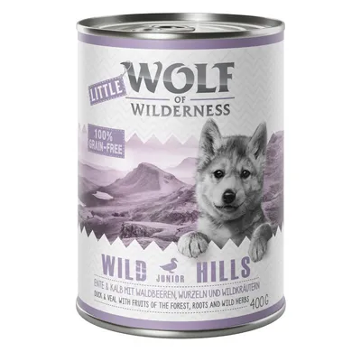 Boîte Wolf of Wilderness Little Junior Wild Hills, 100% grain-free, canard et veau avec fruits des bois, racines et herbes sauvages, 400 g. Texte en anglais et allemand visible. Boîte Wolf of Wilderness Little Junior Wild Hills, 100% grain-free, canard et veau avec fruits des bois, racines et herbes sauvages, 400 g. Texte en anglais et allemand visible.