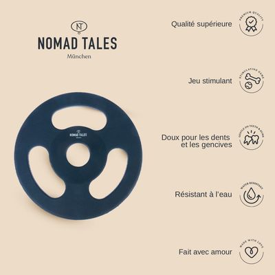 Disque rond noir avec trois ouvertures et le texte visible : NOMAD TALES München au centre.