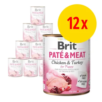 Lot de 12 boîtes Brit Paté & Meat Chicken & Turkey for Puppy, mentionné sans céréales, sans soja ni OGM, visible sur l’emballage.