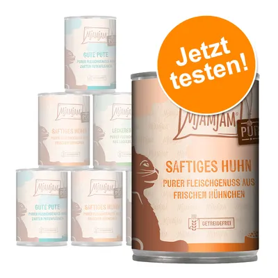 Conserve MjAMjAM cu text vizibil: Saftiges Huhn, Purer Fleischgenuss aus frischem Hühnchen, Getreidefrei. Etichetă portocalie: Jetzt testen! Alte conserve: Gute Pute, Leckeres.