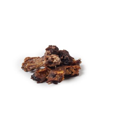 Several dried meat bones on a white background, loosely stacked.