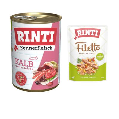Boîte de nourriture pour chien Rinti Kennerfleisch mit Huhn getreidefrei, morceaux de viande visibles sur l’étiquette. Texte en allemand.