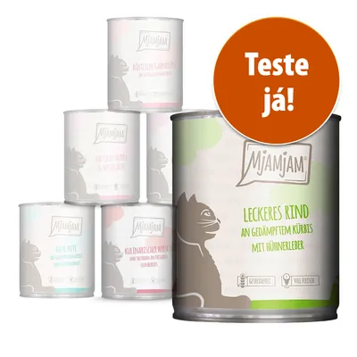 Várias latas de comida para gatos MjAMjAM. Texto visível: 'Leckeres Rind an gedämpftem Kürbis mit Hühnerleber'. Selo laranja com texto: 'Teste já!'. Várias latas de comida para gatos MjAMjAM. Texto visível: 'Leckeres Rind an gedämpftem Kürbis mit Hühnerleber'. Selo laranja com texto: 'Teste já!'.