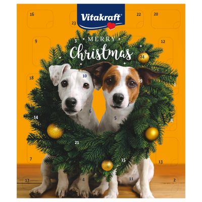 Vitakraft Kalendarz adwentowy z dwoma psami w świątecznym wieńcu, numerami od 1 do 24 oraz napisem Merry Christmas na pomarańczowym tle.